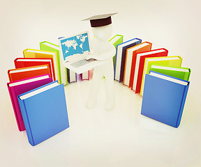 Image showing 3d man in graduation hat working at his laptop and books . 3D il
