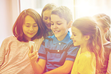 Image showing group of school kids taking selfie with smartphone