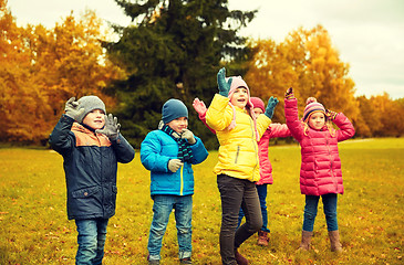 Image showing group of happy children having fun in autumn park