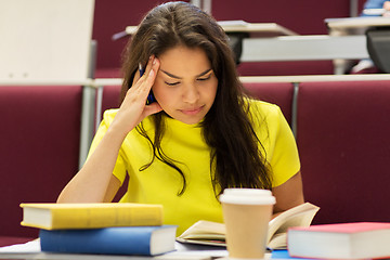 Image showing student girl with books and coffee on lecture