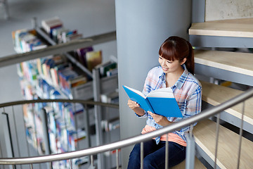 Image showing high school student girl reading book at library