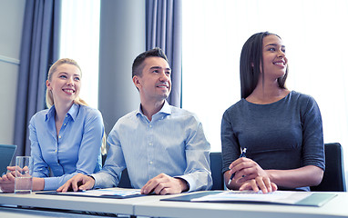 Image showing smiling business people meeting in office