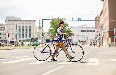 Image showing young man with fixed gear bicycle on crosswalk