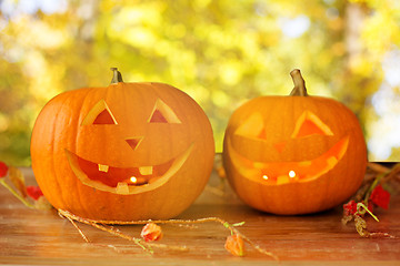 Image showing close up of pumpkins on wooden table outdoors