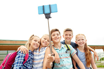 Image showing happy elementary school students taking selfie