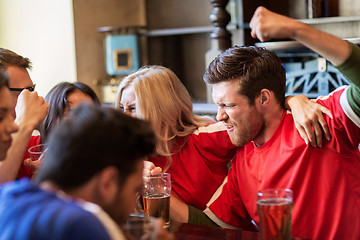 Image showing football fans or friends with beer at sport bar