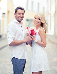 Image showing couple with flowers in the city