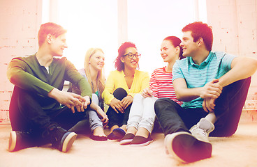 Image showing five smiling teenagers having fun at home