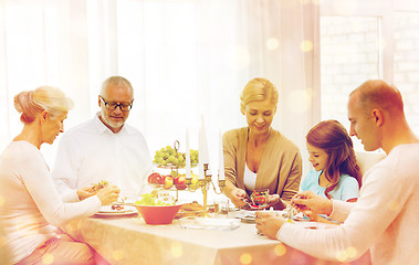 Image showing smiling family having holiday dinner at home