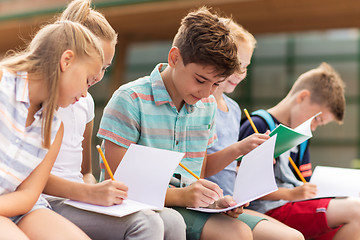 Image showing group of happy elementary school students outdoors