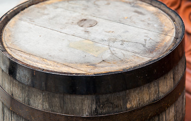 Image showing close up of old wooden barrel table outdoors