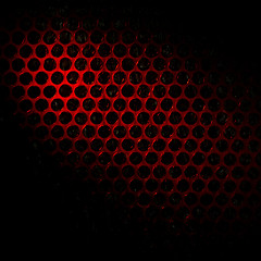 Image showing Bubble wrap lit by red light