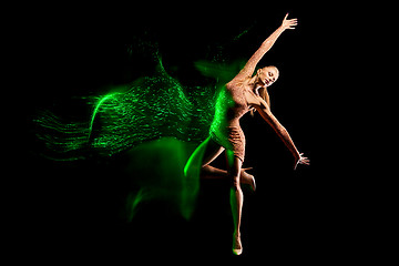 Image showing Fine art portrait of beautiful woman dancer in green sparkles