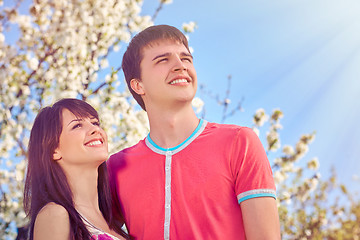 Image showing Young couple enjoying in blooming garden