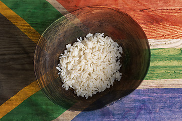 Image showing Poverty concept, bowl of rice with South Africa flag      