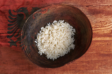 Image showing Poverty concept, bowl of rice with Albanian flag      