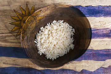 Image showing Poverty concept, bowl of rice with Uruguayan flag      