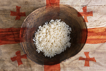 Image showing Poverty concept, bowl of rice with Georgia flag      