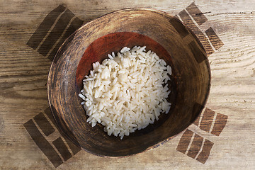 Image showing Poverty concept, bowl of rice with South Korea flag      