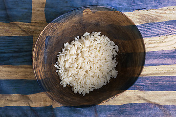 Image showing Poverty concept, bowl of rice with Greek flag      