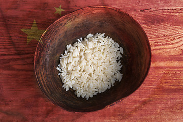 Image showing Poverty concept, bowl of rice with Chinese flag      