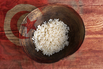 Image showing Poverty concept, bowl of rice with Tunisian flag      