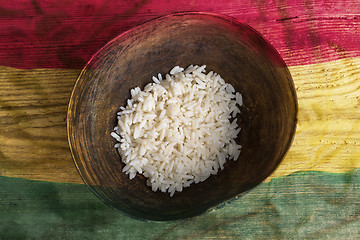 Image showing Poverty concept, bowl of rice with Ghana flag      