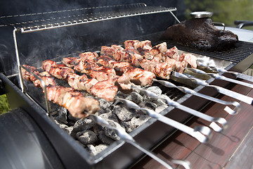 Image showing Grilling shashlik on a barbeque grill outdoor