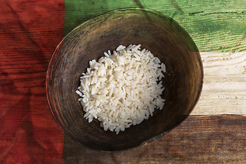 Image showing Poverty concept, bowl of rice with United Arab Emirates flag    