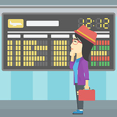 Image showing Woman looking at schedule board in the airport.