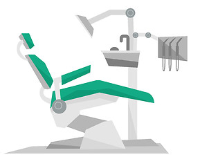 Image showing Dental chair with instruments and tools.