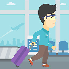 Image showing Man walking with suitcase at the airport.