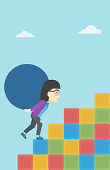 Image showing Woman carrying concrete ball uphill.