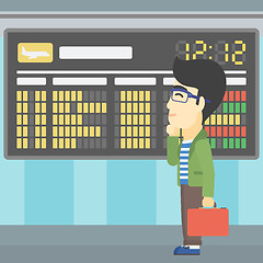 Image showing Man looking at departure board in the airport.