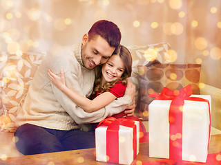 Image showing smiling father and daughter hugging