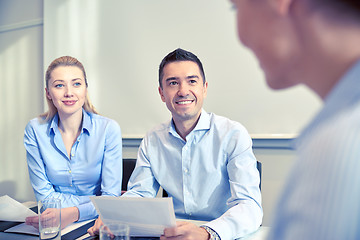 Image showing group of smiling businesspeople meeting in office