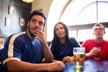 Image showing fans or friends watching football at sport bar