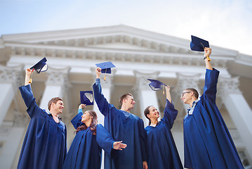 Image showing group of smiling students with mortarboards