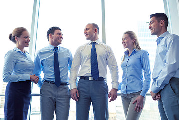 Image showing smiling businesspeople meeting in office