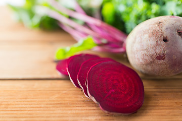 Image showing close up of sliced beet on wood