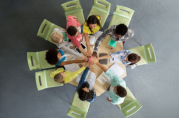 Image showing group of international students making high five