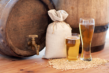 Image showing close up of beer barrel, glasses and bag with malt