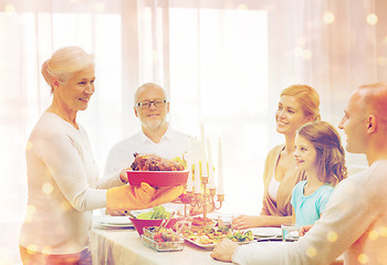 Image showing smiling family having holiday dinner at home