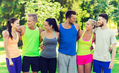 Image showing group of happy friends or sportsmen outdoors