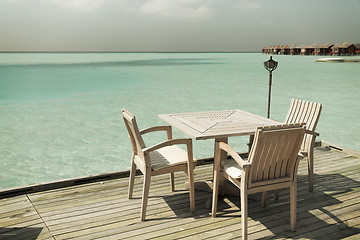 Image showing outdoor restaurant terrace with furniture over sea