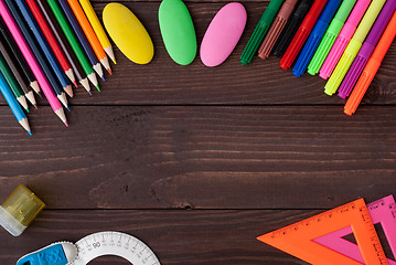 Image showing School supplies on a wooden table