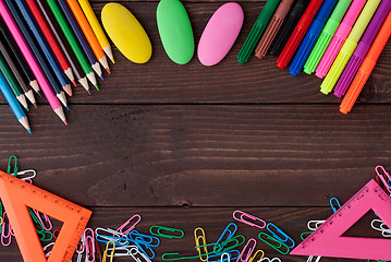 Image showing School supplies on a wooden table