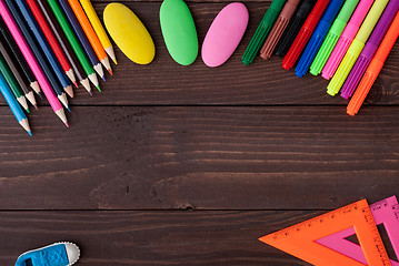 Image showing School supplies on a wooden table