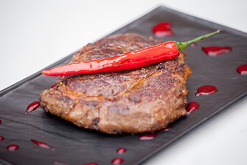 Image showing grilled steak with pepper