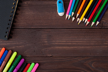 Image showing School supplies on a wooden table